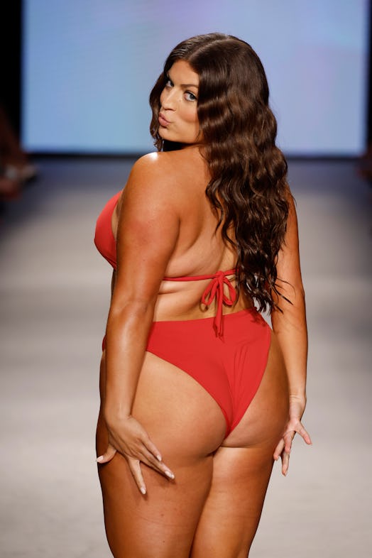 plus-size model ella halikas walks the runway for kittenish during Paraiso Miami Swim Week 2023 in a...