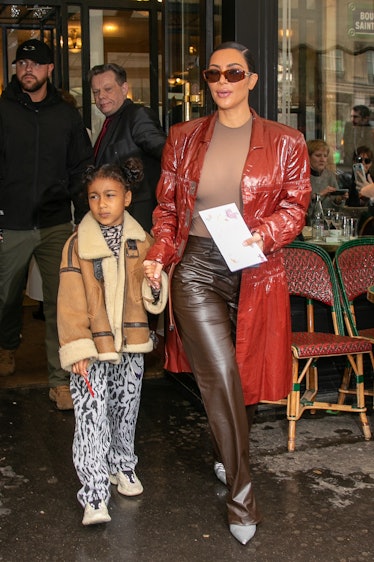Kim Kardashian West and daughter North West are seen leaving the Cafe de Flore restaurant 