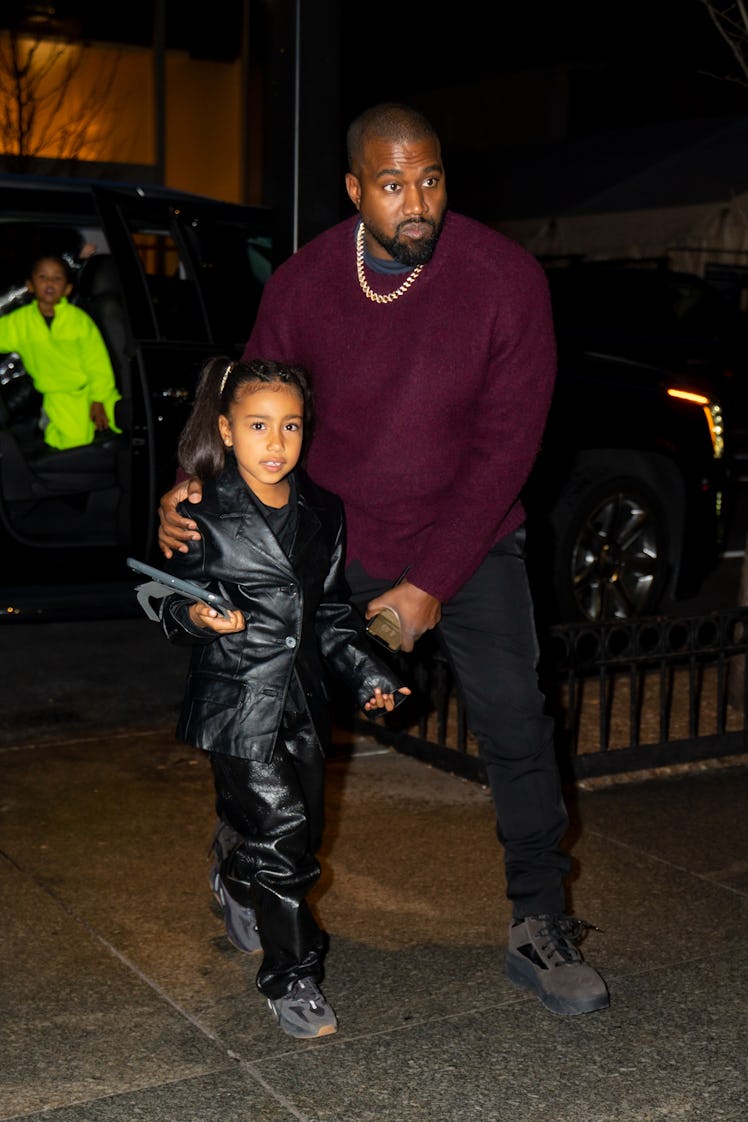 Kanye West and North West are seen in Midtown on December 21, 2019 