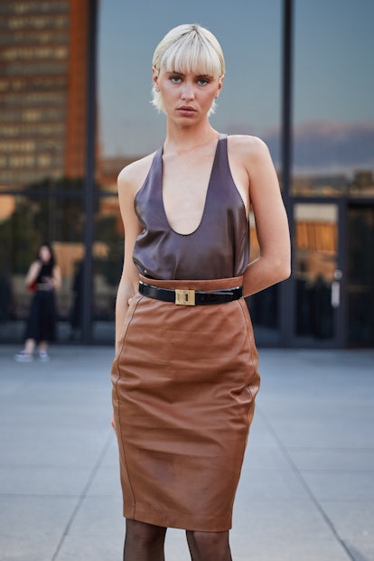Iris Law Pairs a Low-Cut Leather Tank With Brown Pencil Skirt