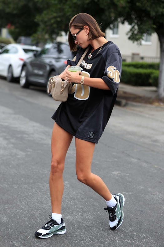Hailey Bieber wears the “no pants” look in a jersey and sneakers while out in Los Angeles, Californi…
