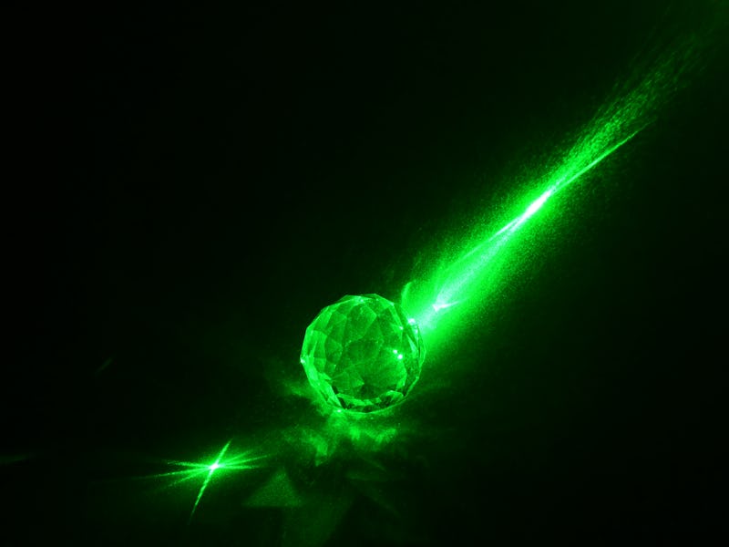 Louisville, CO, USA- January 31, 2021: Electro Optics. The Light from a laser beam is scattered afte...