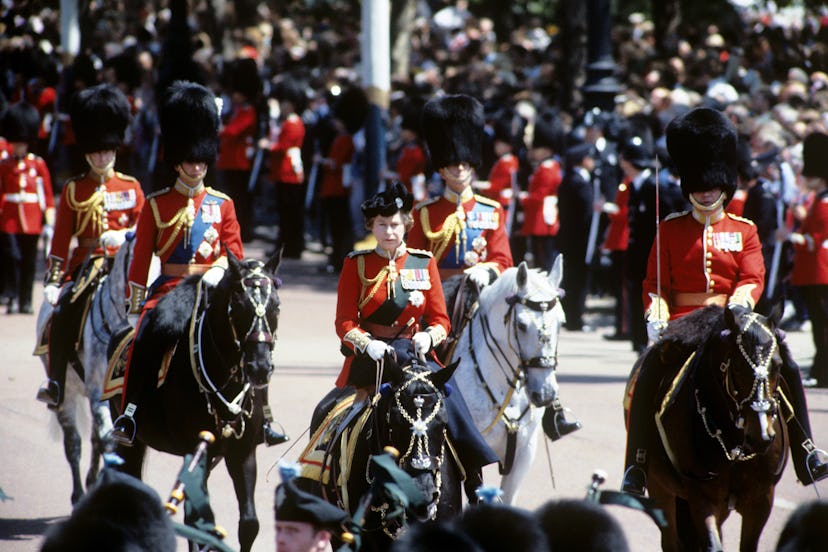 Queen Elizabeth II riding on her horse "Burmese" during the Trooping of the Colour. Behind Her Majes...