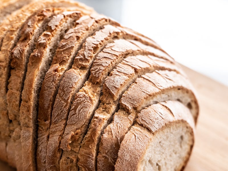 13 December 2021, Baden-Wuerttemberg, Rottweil: A sliced wheat mix bread lies on a table. Photo: Sil...