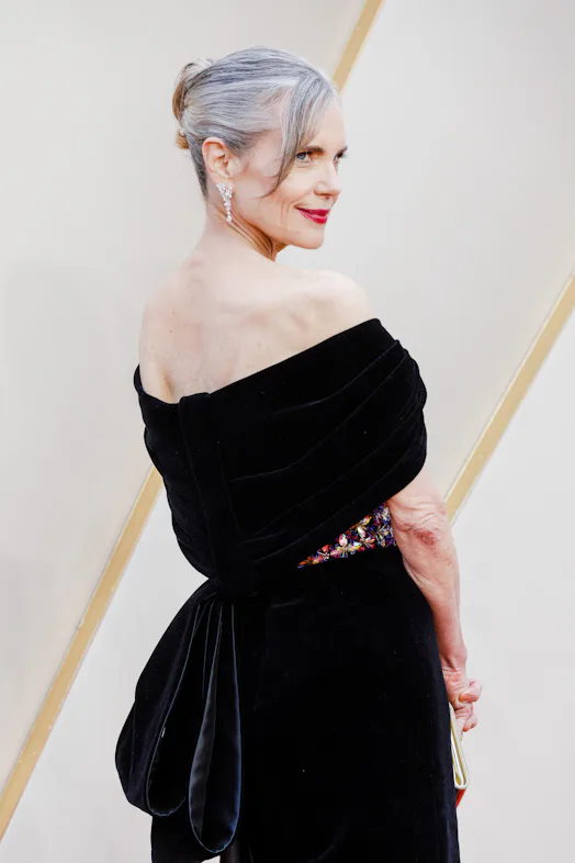 Elizabeth McGovern long silver gray hair in slicked-back bun