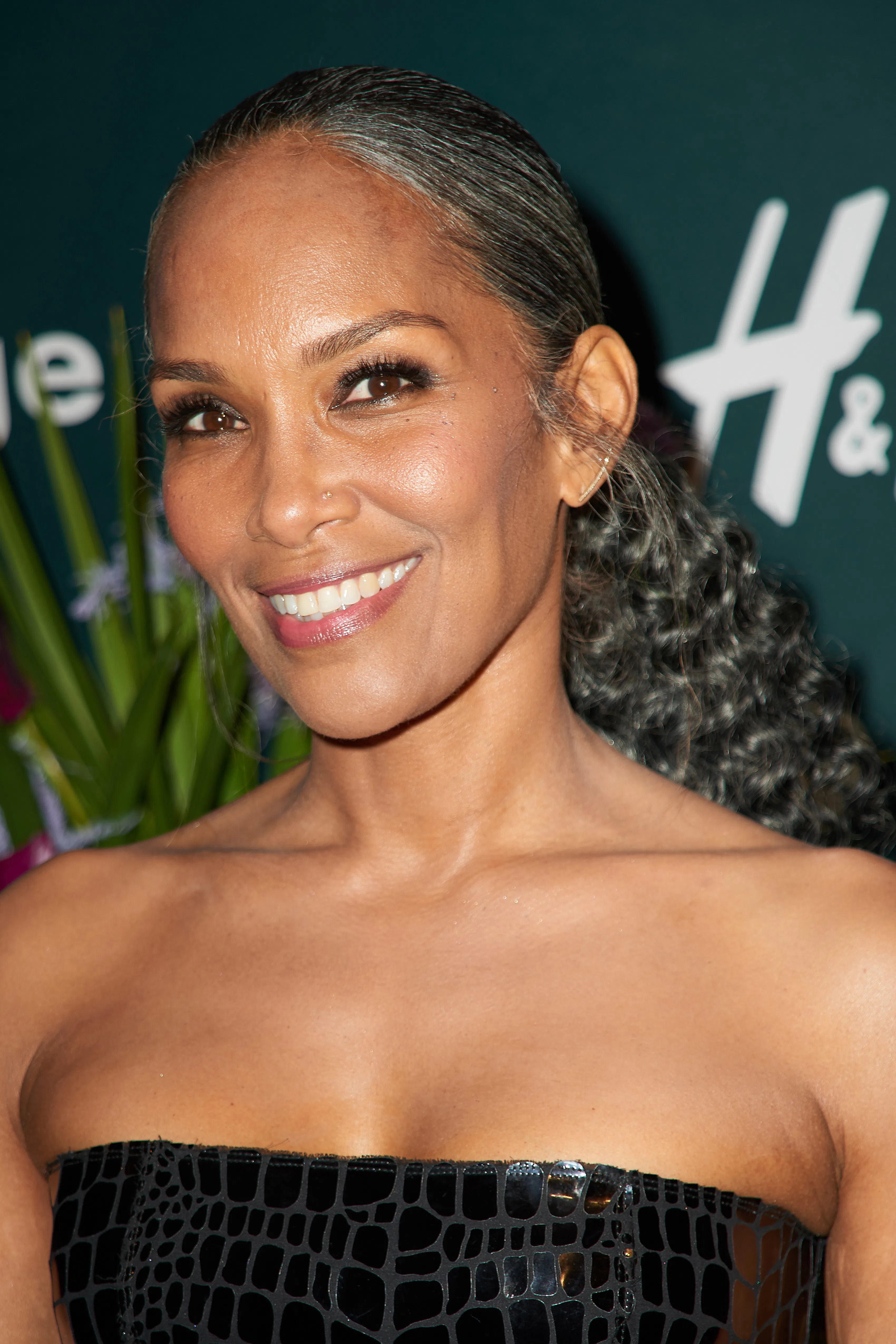 Mara Brock Akil attends silver curls in half-up ponytail