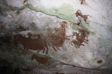 An October 2011 photo of prehistoric rock paintings seen in a cave near Raha, Muna Island, Southeast...