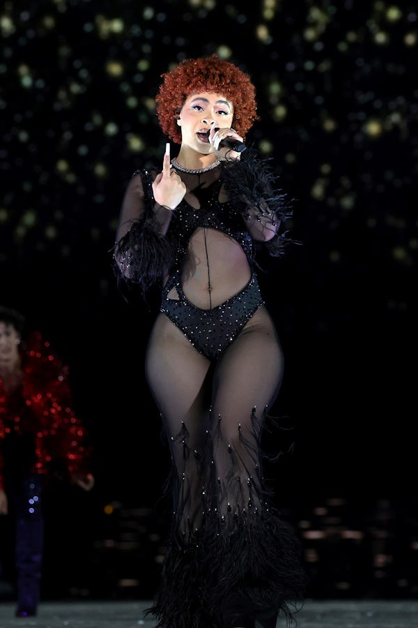 Ice Spice performs in a Theophilio sheer jumpsuit during Taylor Swift’s Eras Tour.