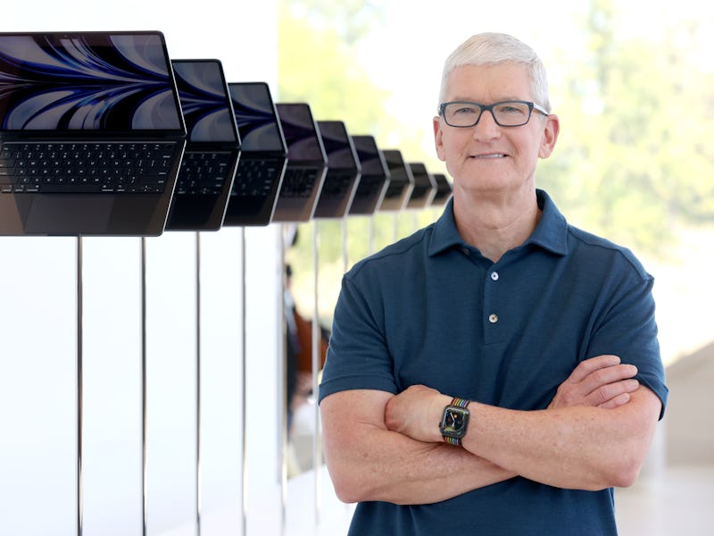 CUPERTINO, CALIFORNIA - JUNE 06: Apple CEO Tim Cook stands next to a display of newly redesigned Mac...