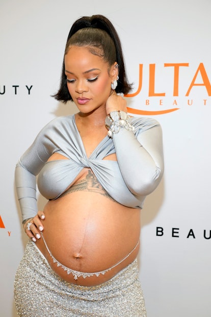Rihanna pregnant in silver dress and eyeliner at Ulta opening