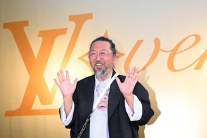 Japanese artist Takashi Murakami poses for a photocall at the Louis Vuitton Menswear Spring-Summer 2...