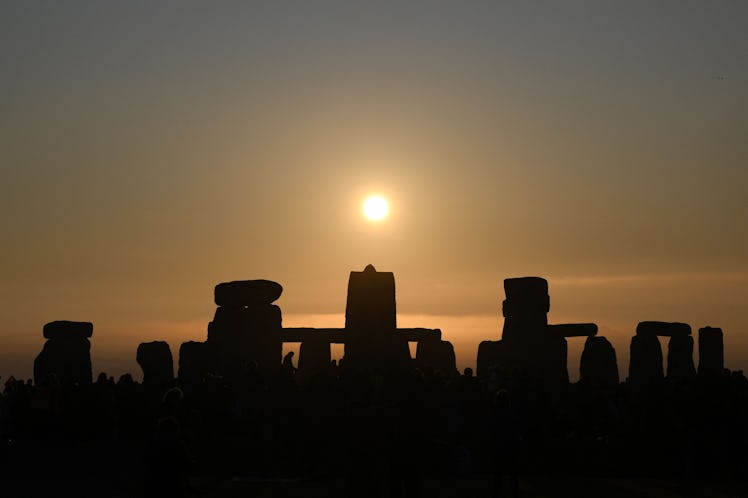 TOPSHOT - The sun rises at Stonehenge, near Amesbury, in Wiltshire, southern England on June 21, 202...