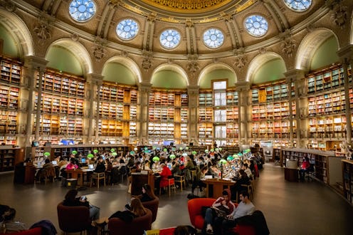 Paris, France - December 11, 2022: people sitting in the large reading hall of the public Richelieu ...