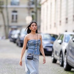 Angela Gonzalez in Paris with strapless denim top and chanel crossbody