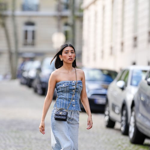 Angela Gonzalez in Paris with strapless denim top and chanel crossbody