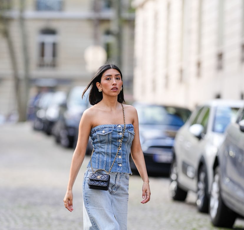 Angela Gonzalez in Paris with strapless denim top and chanel crossbody