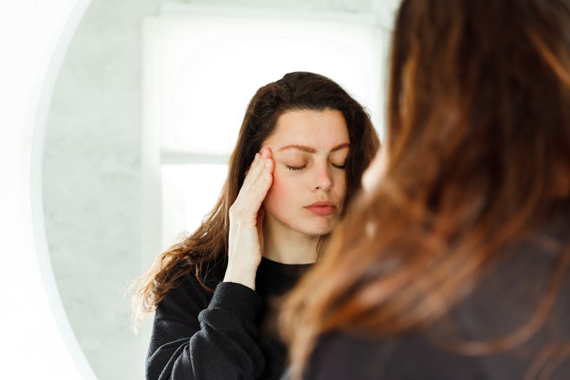 Shot of a pregnant woman experiencing discomfort in the bathroom at home