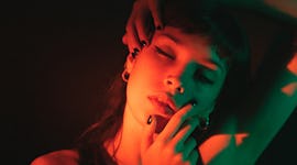 Portrait of young woman illuminated neon light on July 17, 2023, the most transformative day of the ...
