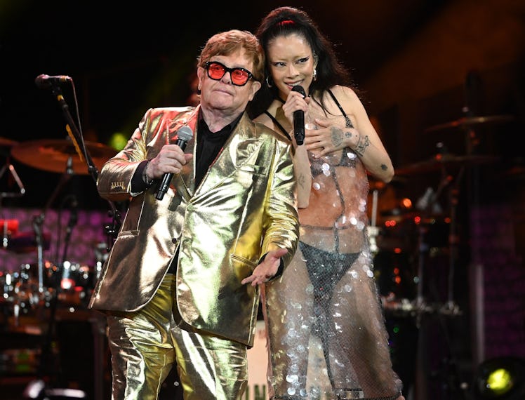 British legendary singer Elton John (L) performs with Rina Sawayama (R) on the Pyramid Stage on day ...