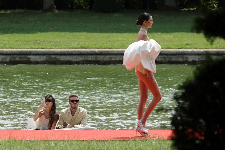 Victoria Beckham and David Beckham watch Kendall Jenner on the runway during the "Le Chouchou" Jacqu...
