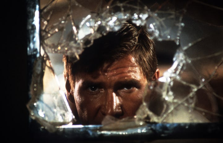 Harrison Ford looks through broken glass in a scene from the film 'Indiana Jones And The Temple Of D...