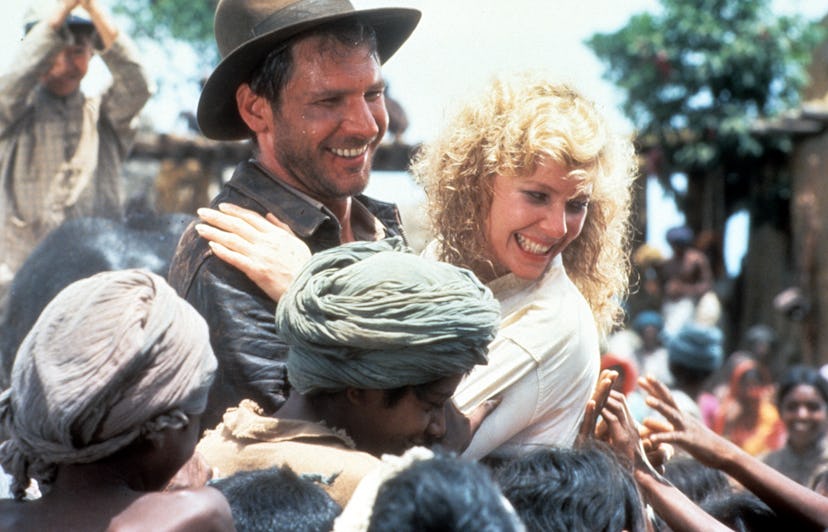 Harrison Ford and Kate Capshaw are greeted by children in a scene from the film 'Indiana Jones And T...