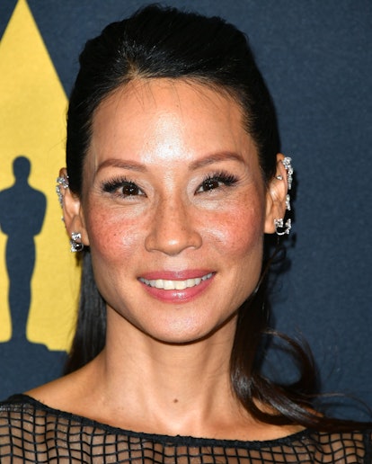 Lucy Liu double cartilage piercing stack