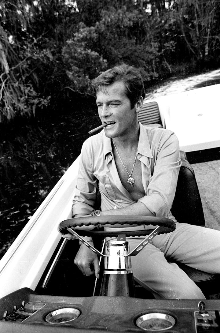 KINGSTON, JAMAICA - MARCH 01: Roger Moore takes a break during filming of the James Bond film 'Live...