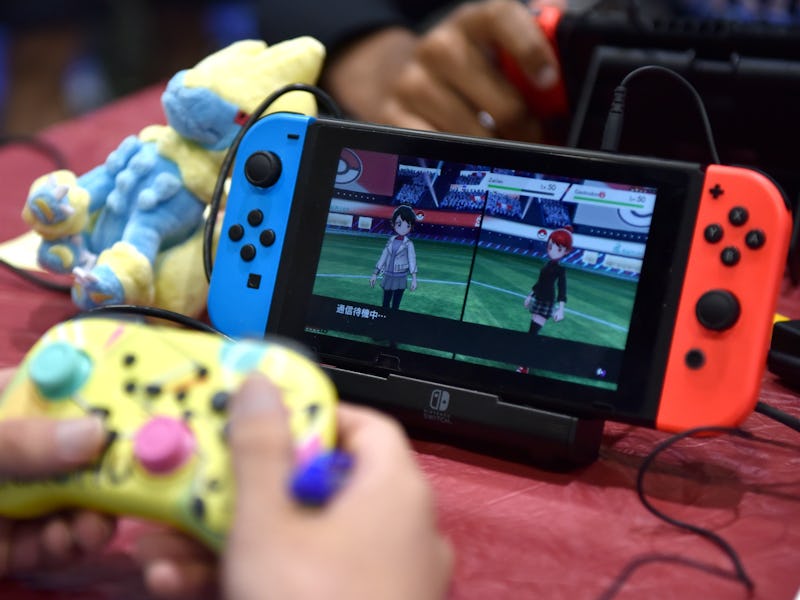 LONDON, ENGLAND - AUGUST 18: A competitor plays Pokemon on a Nintendo Switch console during the 2022...