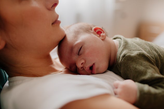 Emo baby names would suit this newborn, asleep on his mom's chest.