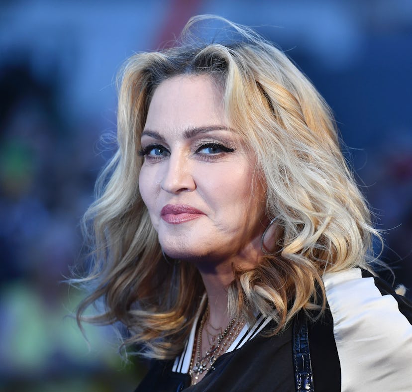 US singer-songwriter Madonna poses arriving on the carpet to attend a special screening of the film ...