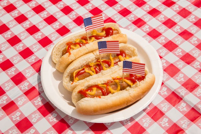 America, Fourth of July foods: hot dogs. Indulgence and overeating concept for unhealthy eating of j...