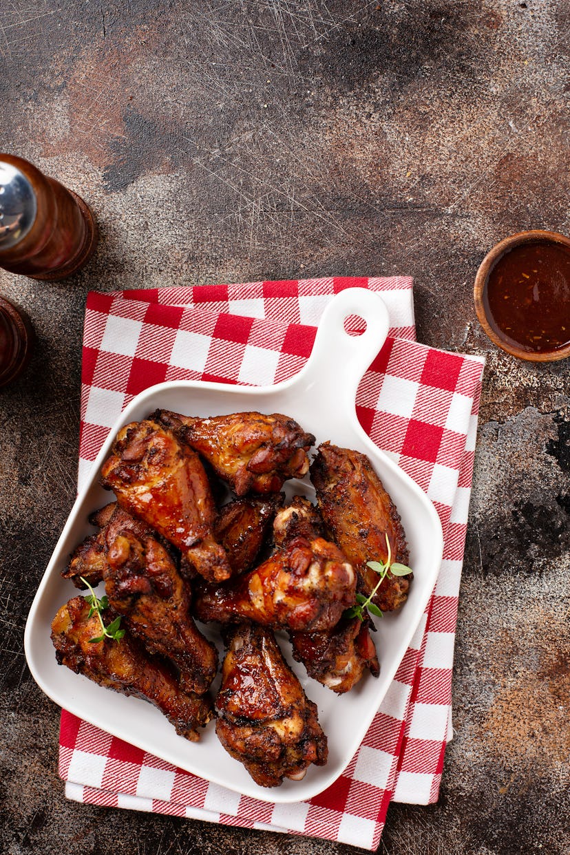 Wings are the barbecue food that match Aries' vibe, according to an astrologer.