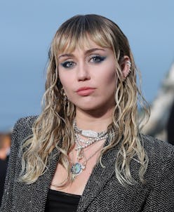 Miley Cyrus cartilage piercings and bangs at Saint Laurent show 2020