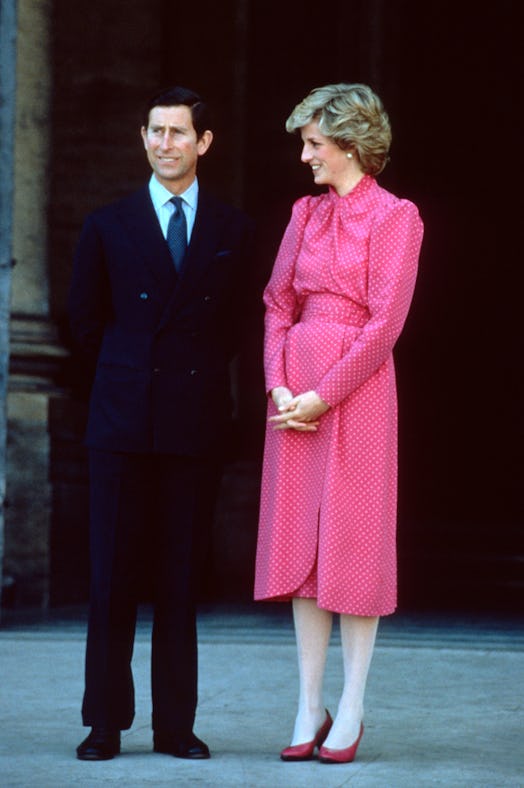 Princess Diana wearing a pink and white polka dot dress. 