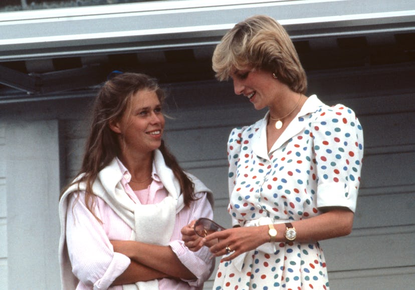 Princess Diana wearing a white dress with red and blue polka dots. 