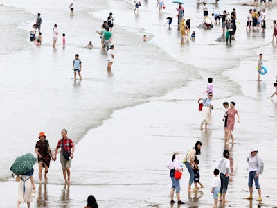 FUZHOU, CHINA - JUNE 23, 2023 - Tourists cool off at the beach during high temperatures in Fuzhou, E...