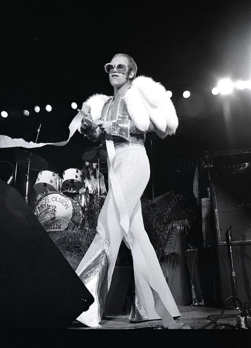 UNITED STATES - OCTOBER 01:  Photo of Elton JOHN; Elton John performing on stage, full length, fur  ...
