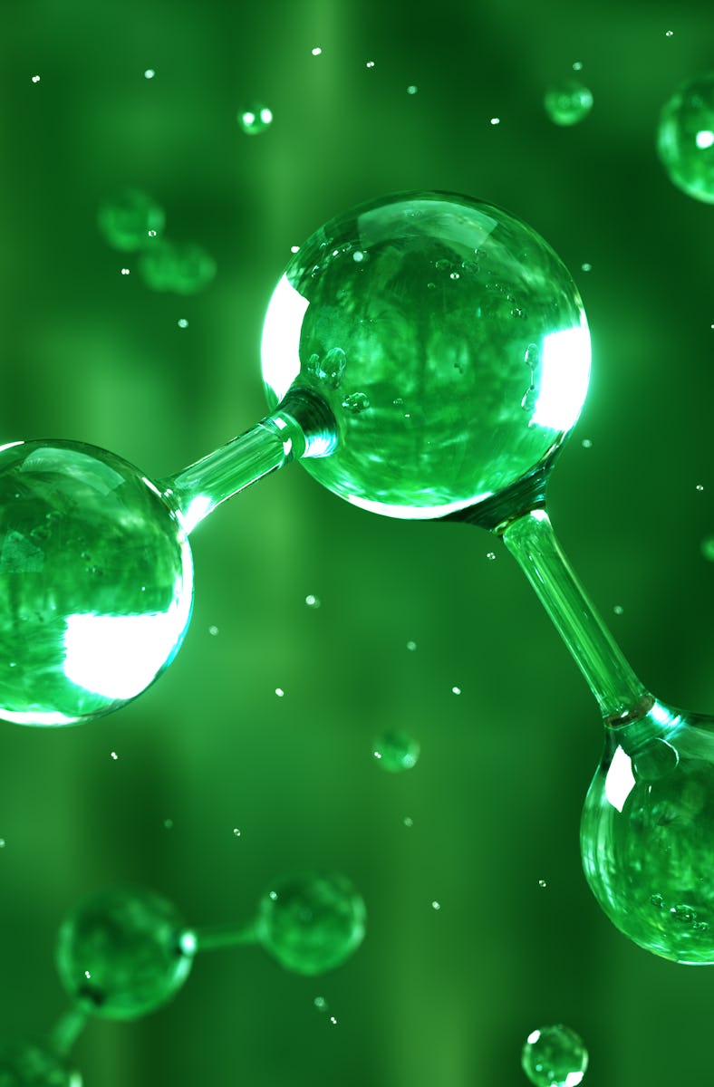 Digital generated image of H2 hydrogen molecule made out of liquid on green background.