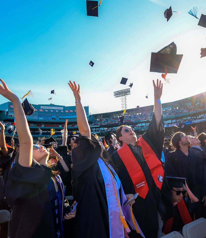 Boston, MA - May 7: Northeastern University students celebrate the conclusion of their University's ...