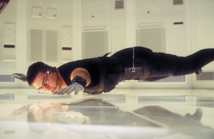 American actor Tom Cruise as Ethan Hunt in a scene from the film 'Mission: Impossible', 1996. Here h...