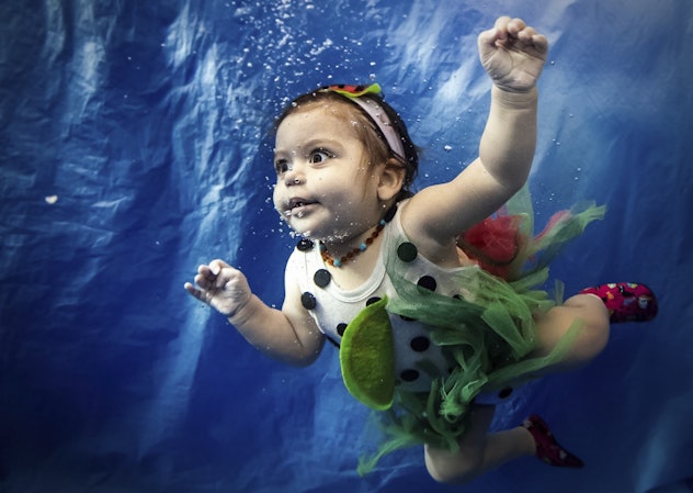 baby girl in Istanbul goes for an underwater swim