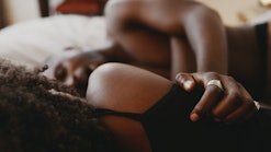 Shot of an affectionate young couple sharing an intimate moment in bed, in a story answering the que...