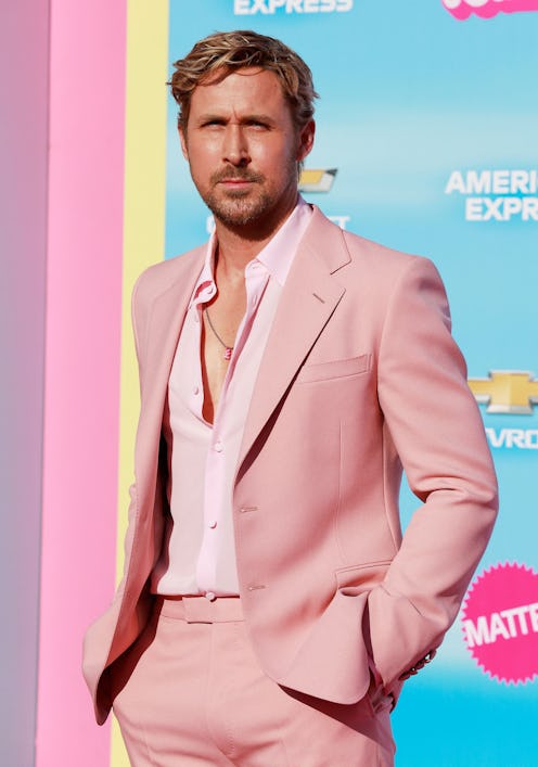 Ryan Gosling wears a pink suit, silk shirt, and cream shoes to attend the World Premiere of "Barbie....