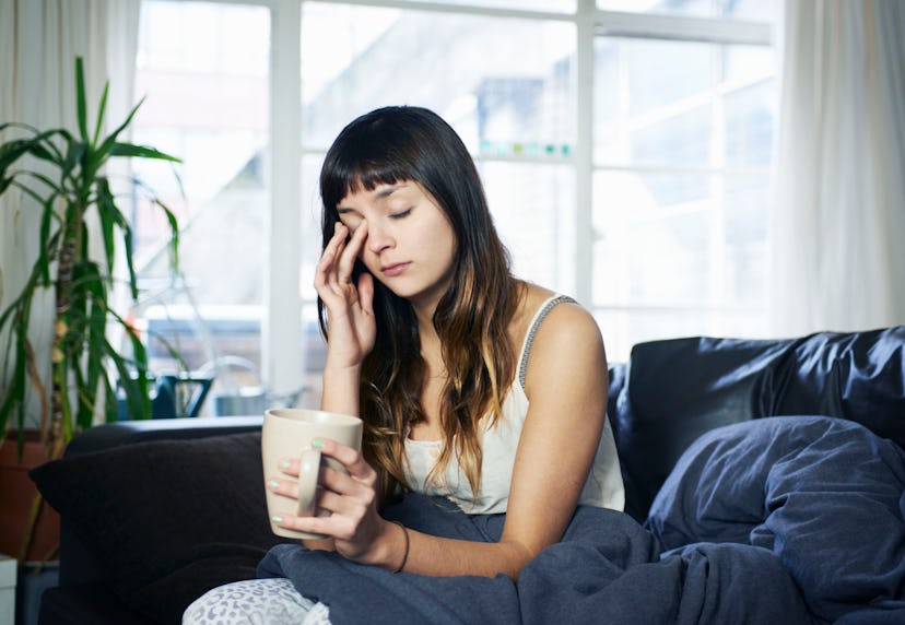 a sleepy woman in an article about if ovulation makes you sleepy 