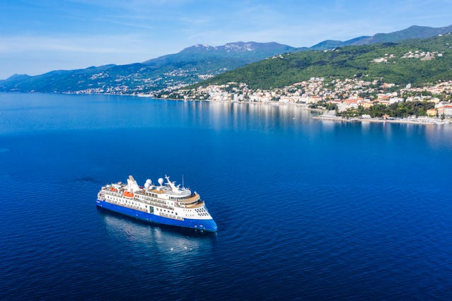 Opatija, Croatia - May 7, 2023: Cruise ship in front of Opatija
