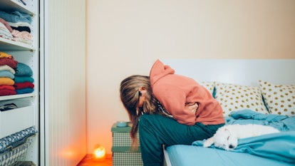 Young woman with morning sickness before a positive pregnancy test