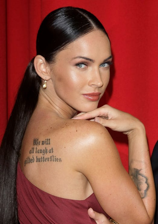 Megan Fox back tattoo and arm tattoo