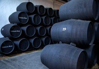 Oak barrels of maturing sherry wine cellar, Gonzalez Byass bodega, Jerez de la Frontera, Cadiz provi...
