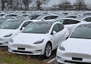 09 January 2023, Brandenburg, Schönefeld: New Model Y electric vehicles are parked in the early morn...